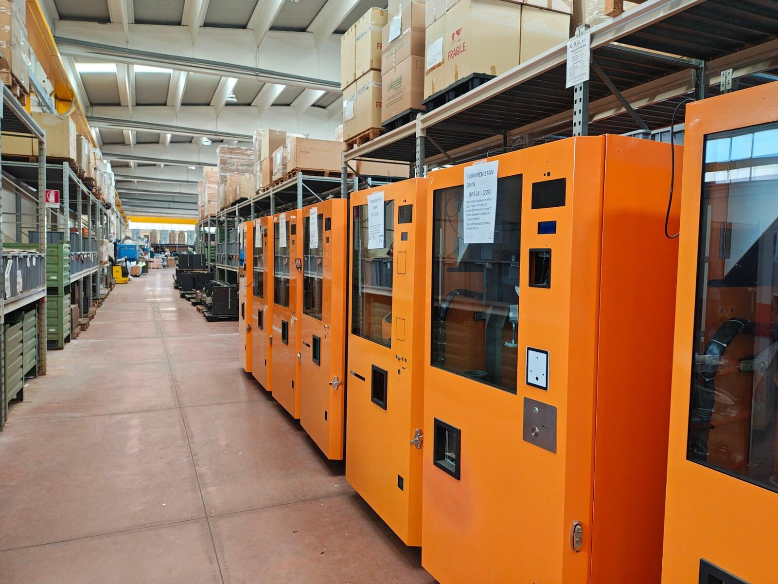 Row of orange JuiceBots ready for deployment